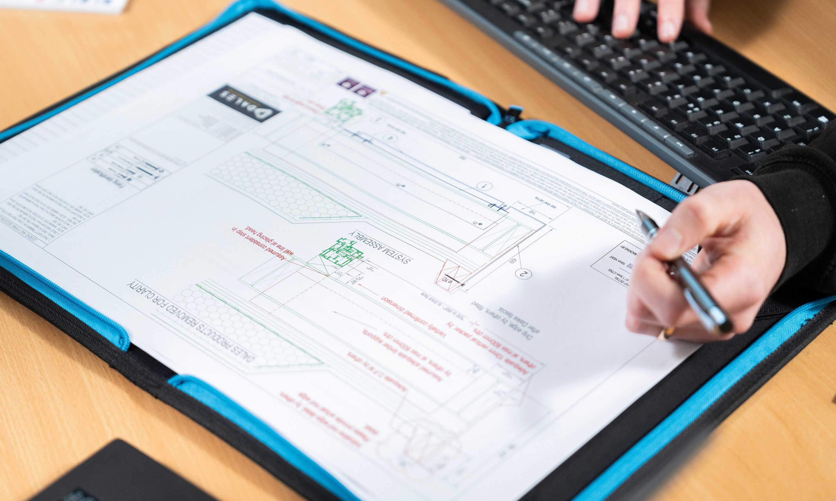 Dales Fabrications team member reviewing bespoke drawings during the design process.